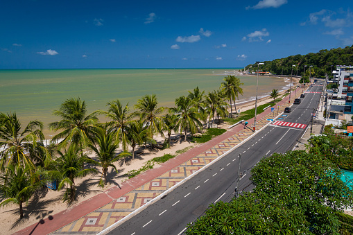 Cabo Branco beach with white sands and coconut grove in João Pessoa, Paraíba State, Brazil on March 10, 2009. The extreme eastern geographic point of the Americas.