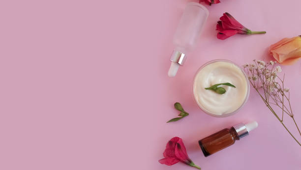 istock cream cosmetic rose flower on colored background 1305684258