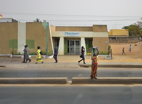 Ouagadougou, Burkina Faso. December 2017. The capital of Burkina Faso is a large city where traffic is intense at all hours of the day. For this reason, many inhabitants use motorcycles to get around. In this photo you can see a boy on a motorcycle