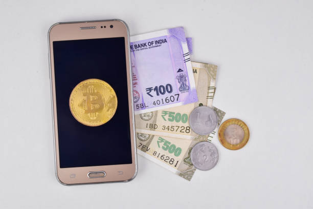 Bitcoin investing through mobile phone and get returns in indian rupees concept, cryptocurrency concept. stock photo