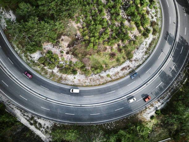 istock Red color challenge ,Vehicles going on mountain winding road roads 1305690252