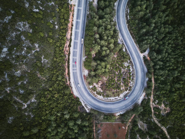 istock Red color challenge ,Vehicles going on mountain winding road roads 1305690277