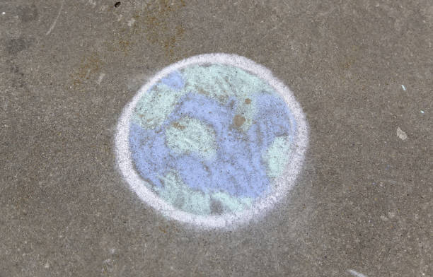 istock Drawing of the world on ground 1305691476