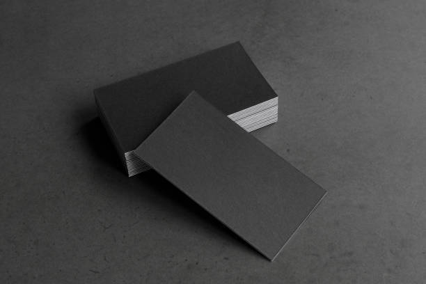 istock Business card on black background. 1305695306