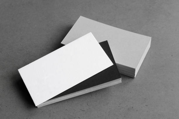istock Business card on black background. 1305695309