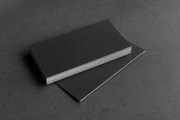 istock Business card on black background. 1305695317