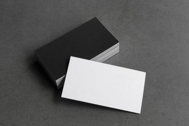 istock Business card on black background. 1305695337