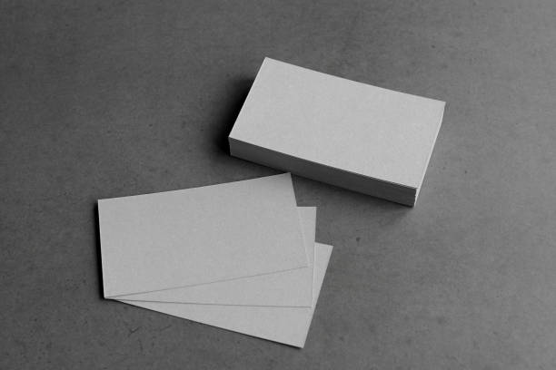istock Business card on black background. 1305695414