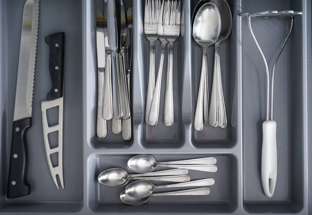istock Set of cutlery in kitchen drawer, above view. 1305699453