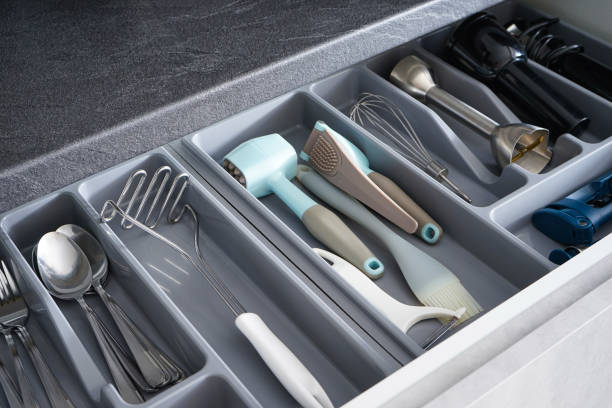 istock Set of clean kitchen utensils in drawer, above view. 1305699497