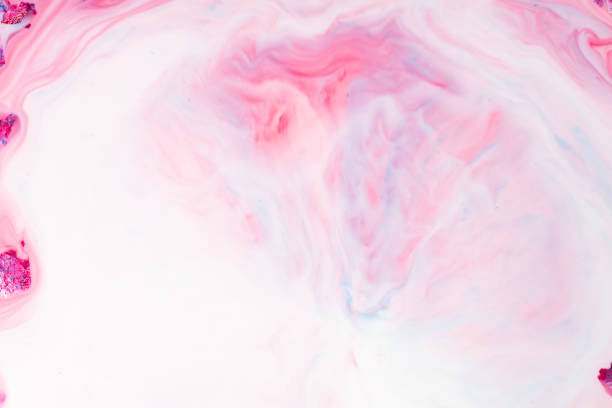 pink and purple paints dripping isolated on white background