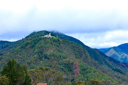 Bogotá, Colombia - Looking From The Andes Peak Of Monserrate Towards The Peak Of Guadalupe; The Convenent On Top Of The Hill Can Clearly Be Seen.