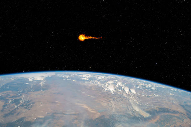istock Asteroid passing planet Earth, elements of this image furnished by NASA 1305702821