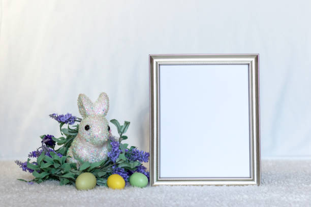 istock Mockup frame with copy space next to purple lilac flowers and Easter Bunny 1305704495