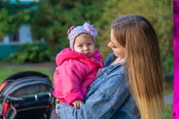 istock Young mother with her daughter on a warm autumn evening 1305704833