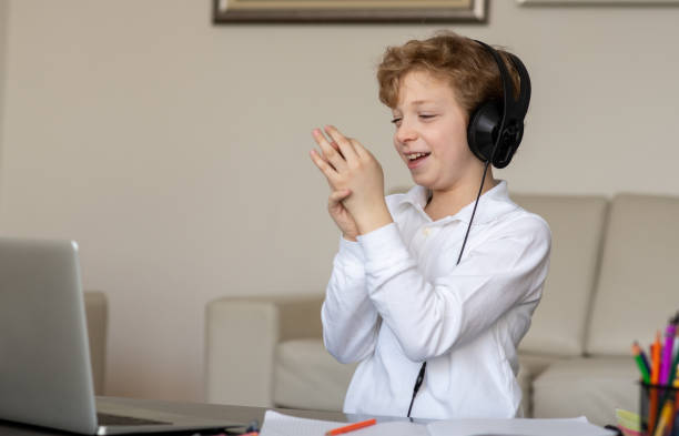 istock Young boy is happy because he did his homework well. 1305707814