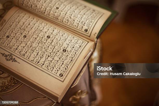 Directly Above View Of Quran With Old Pages Standing On The Table Stock Photo - Download Image Now