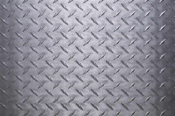 istock shiny metal texture with diamond pattern. stainless steel background 1305711353