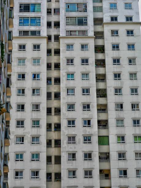 istock Front view of run down  residential building 1305711424