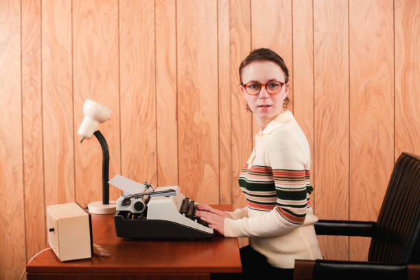 istock Retro Office Secretary Sitting at 1970s era Desk 1305711452