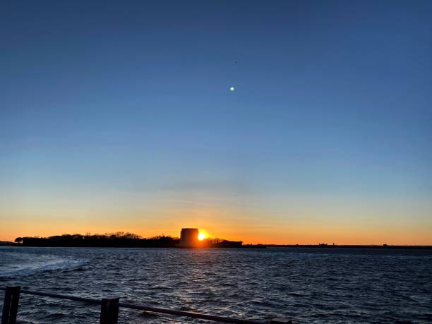 istock Sunset Over Governors Island 1305729080