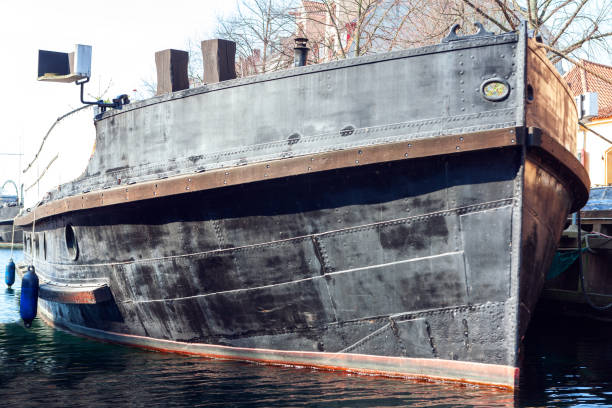 istock Old ship painted in black moored on the harbor 1305730186