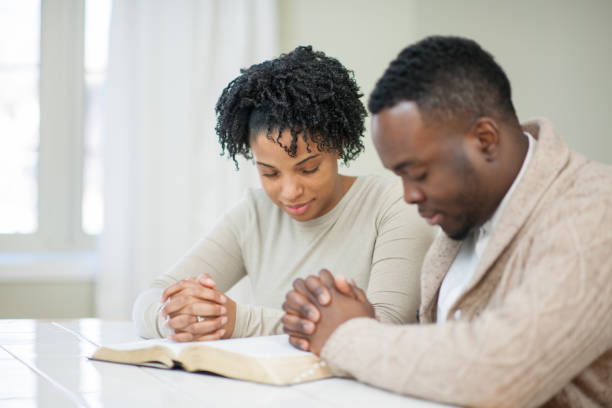 istock Saying A Prayer Stock Photo 1305733658
