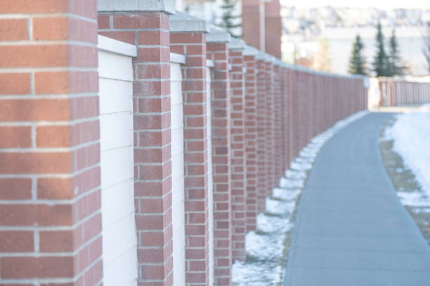 istock wood wall beside a walkway pavement in city 1305736196