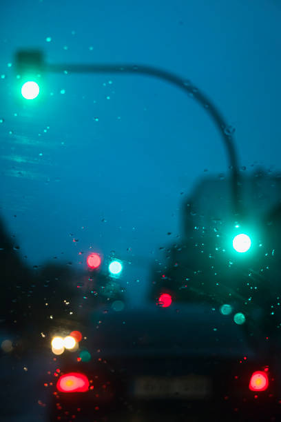 istock City driving in rainy weather. 1305752010