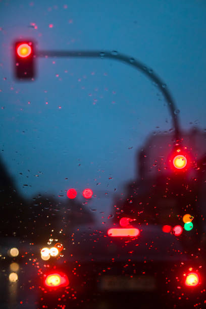 istock City driving in rainy weather. 1305752017