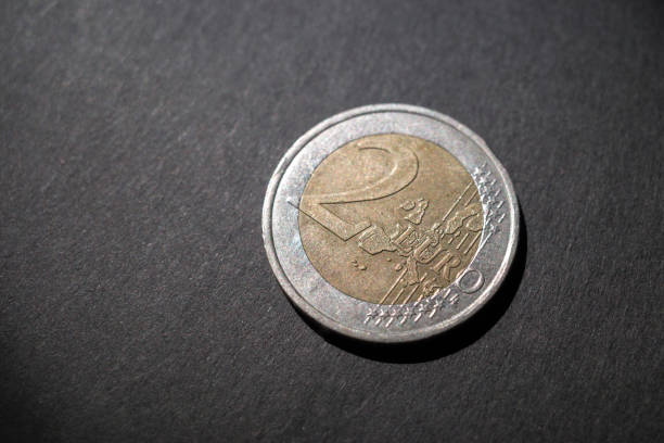 istock 2 euro coin illuminated by light 1305753090