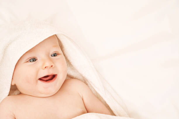 istock Cute small boy lying at bed. Childhood bath concept. 1305753849