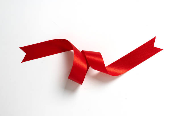 istock A roll red ribbon isolated on white background 1305754200