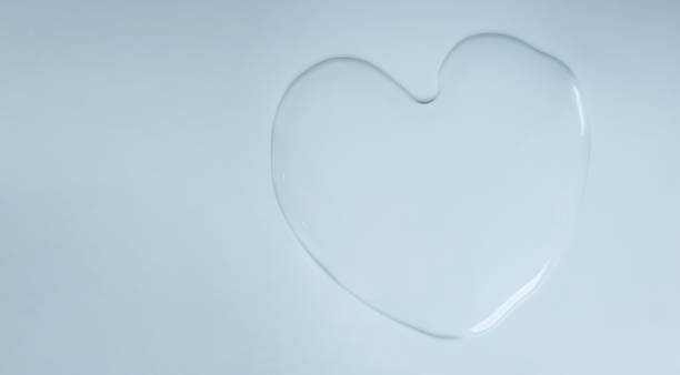 istock Heart Shape Water Drops on White Background. World Water Day Concept. Top View 1305755997