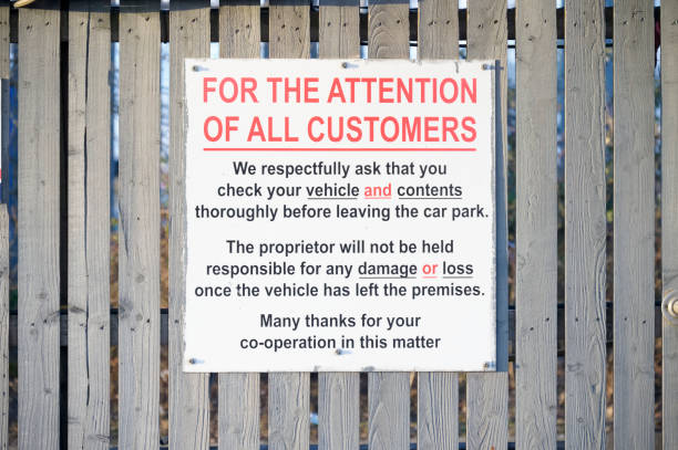 istock Car park users do so at own risk sign 1305756832