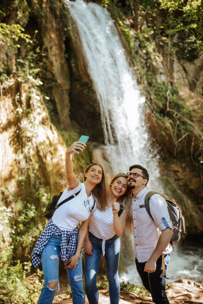 istock Cheerful friends taking selfie in nature 1305762167
