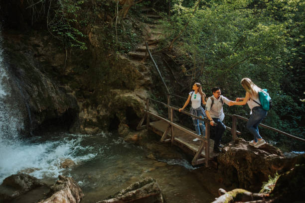 istock Young hikers taking a break to admire the view 1305762734