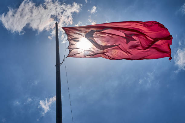 istock Turkish National Flag Waving  Up In The Sky 1305763890