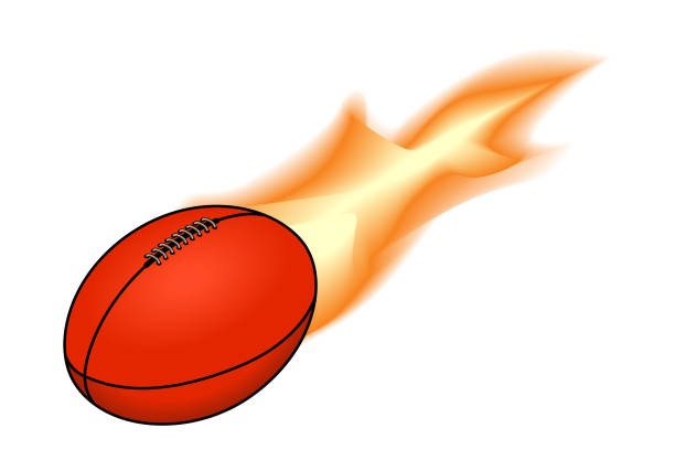 Flaming Australian Rules football An Australian Rules football trailing fire flame. football league stock illustrations