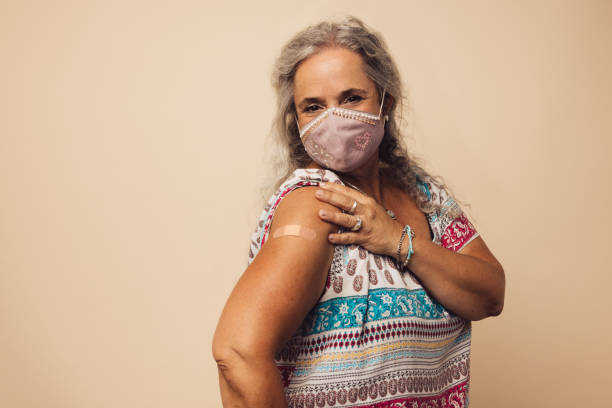 Woman showing her arm after getting vaccine