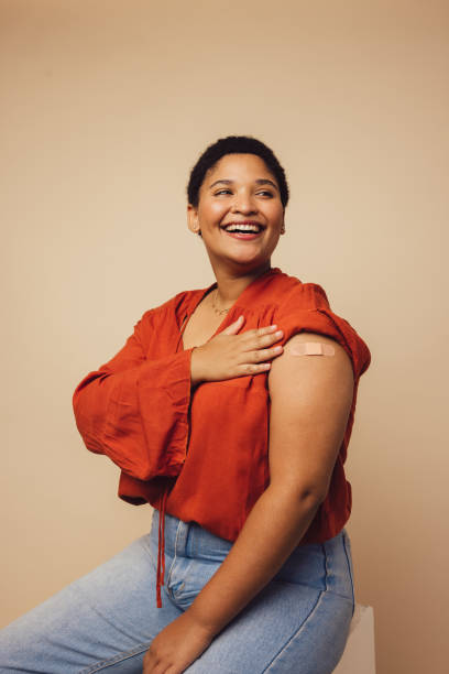 istock Woman smiling after getting covid-19 vaccine 1305768185