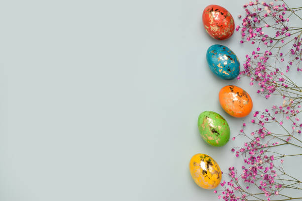 istock Easter. Frame their flowers and eggs. An Easter card with a copy of the place for the text. A copy of the space. Top view. Flat spoon 1305773779