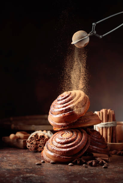 istock Freshly baked sweet buns sprinkled with cinnamon powder. 1305773982