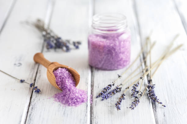 istock Lavender salt and dried lavender flowers on a white old wooden table. Selective focus. 1305776892