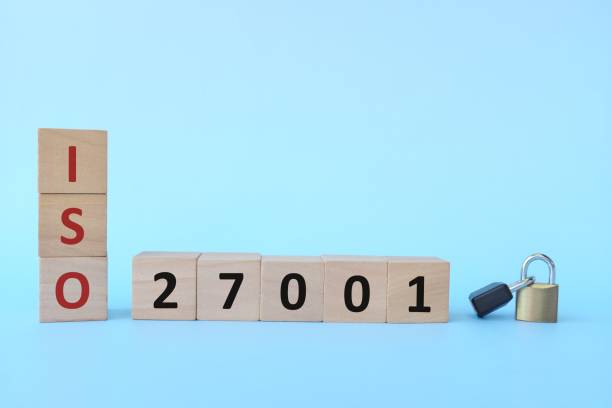 istock ISO 27001 on wooden blocks with padlock. Information security management system concept. 1305779514