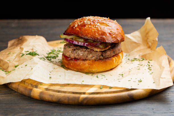 istock Perfect hamburger classic burger american cheeseburger with cheese, bacon, tomato and lettuce 1305780340