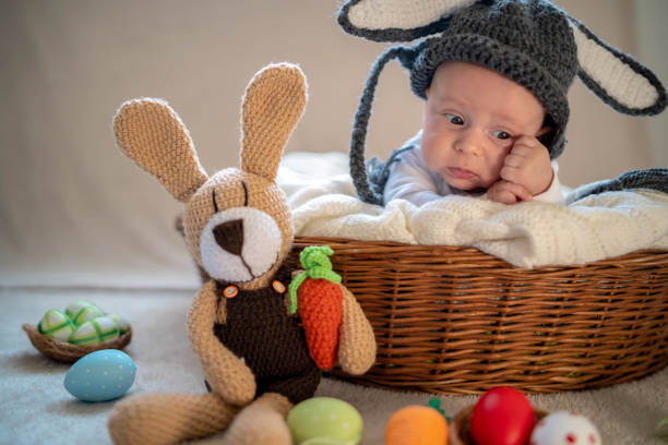 istock Cute baby bunny in the basket 1305781844