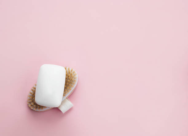 istock White soap bar on wooden brush. 1305782065