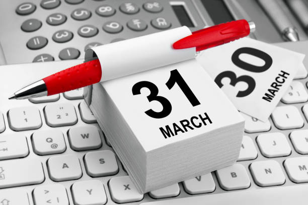 Business calendar March 31 and PC keyboard