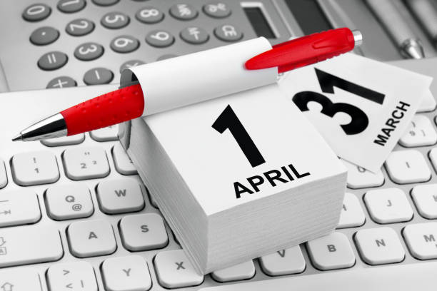 istock Workplace with calendar April 1 and PC Keyboard close up 1305783789